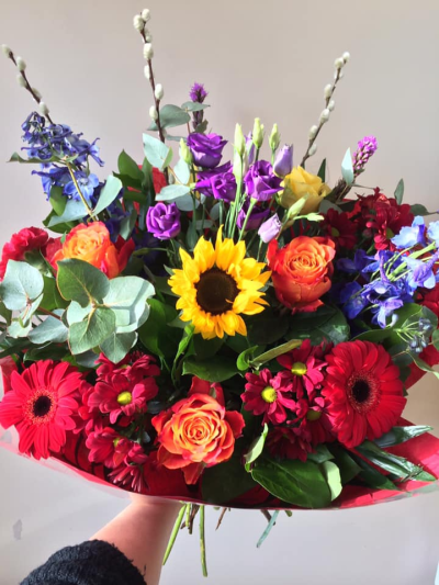 Bright Delight - Beautiful bright flowers in oranges, yellows, purples, blues and reds. Flowers may vary depending on availability.
