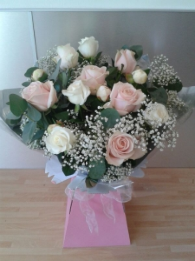 Dozen Pink & Ivory roses - A lovely bouquet of a dozen pink and Ivory roses in an aqua pack.
