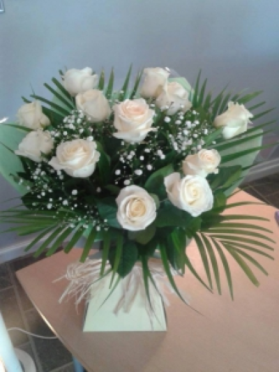 Dozen Cream Roses - Beautiful mix of cream roses, with some foliage and gypsophila in one of our aqua pack boxes.